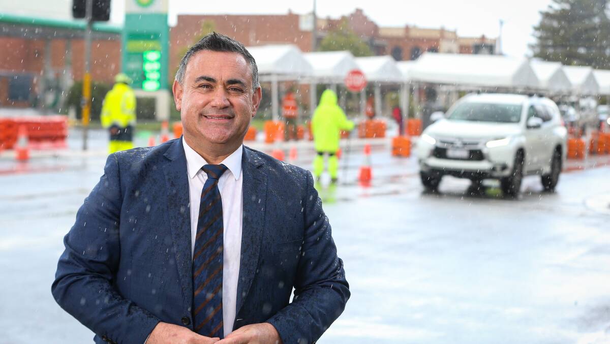 I'm back: NSW Deputy Premier John Barilaro at the Wodonga Place checkpoint in Albury last Thursday amid a shower of rain. He will return there today with Victorian Nationals leader Peter Walsh. Picture: JAMES WILTSHIRE