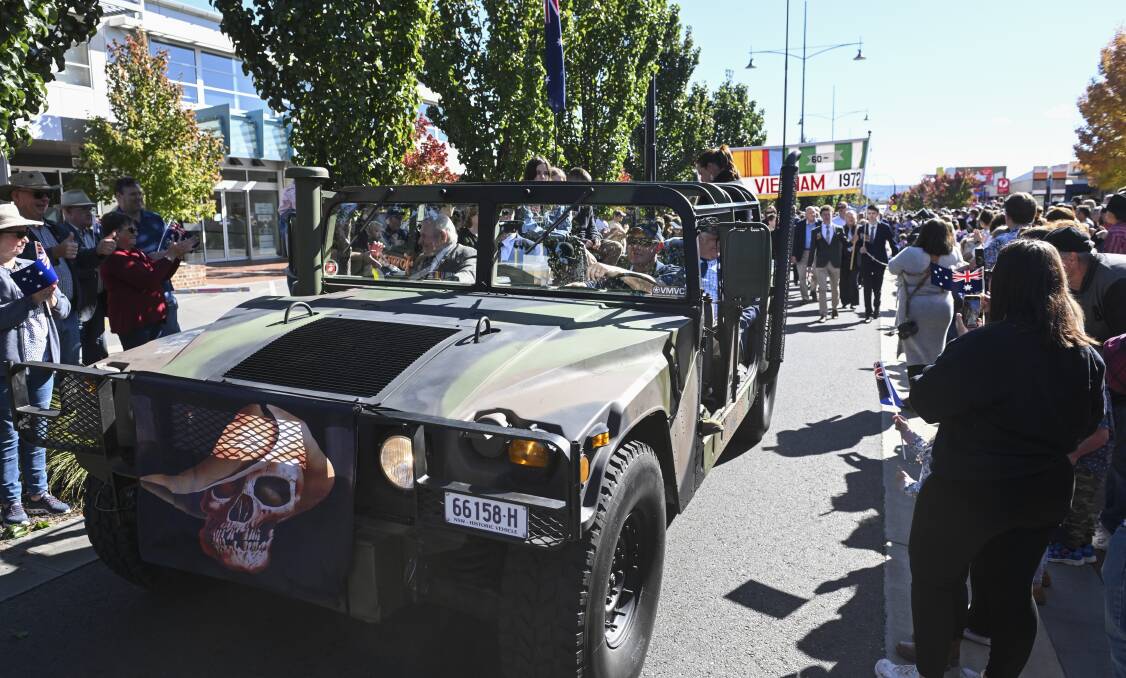 Nico Matthews at the wheel of his left-hand drive Humvee ex-military vehicle gives a ride to Vietnam War veterans as part of Wodonga's Anzac Day parade. Picture by Mark Jesser 