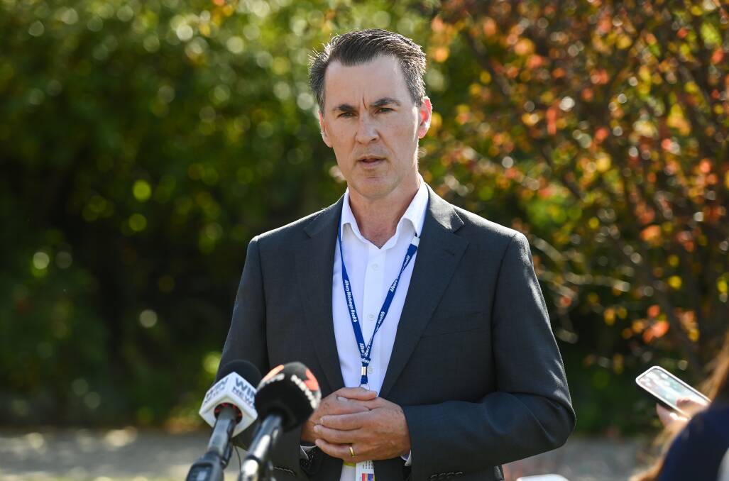 Albury Wodonga Health chief executive Bill Appleby speaking to the media in April when a code yellow had been called due to hospital demand exceeding capacity. In the same month he was supporting a move to intensify the recruitment of nurses from Britain. Picture by Mark Jesser