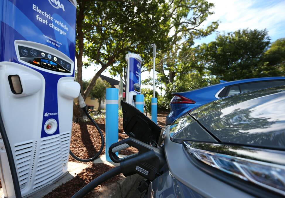 Zapping up: An NRMA fast charger in Newcastle. The organisation has installed units there and at Olympic Park, Sydney, as part of a NSW-wide rollout.
