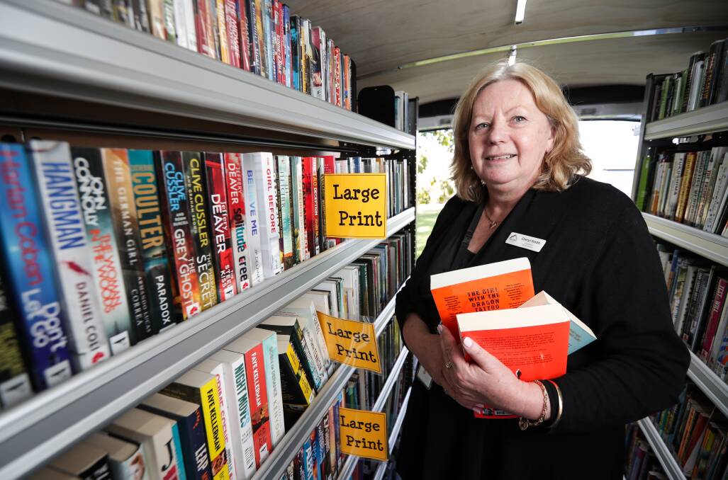 Chapter and verse: Indigo Council library services co-ordinator Cheryl Smith inside the Ford Transit van which will provide book loans to Barnawartha and Kiewa-Tangambalanga residents. Picture: JAMES WILTSHIRE