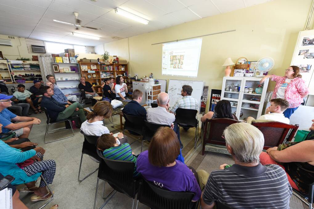 Listening in: The forum on the dole attracted political candidates Dean Moss (Greens) and Labor pair Eric Kerr and Lauriston Muirhead as well as Albury councillor David Thurley to the Global Village shopfront in Mate Street, North Albury. Picture: MARK JESSER