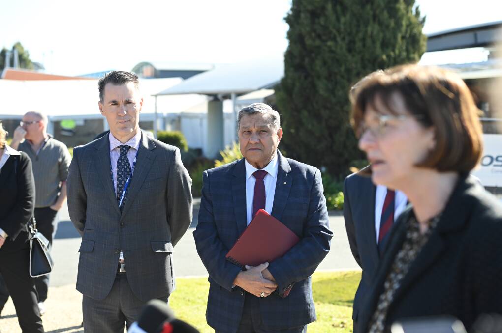 Flashback: Albury Wodonga Health chief executive Bill Appleby and chairman Matt Burke watch Victorian Health Minister Mary-Anne Thomas speak to the media during her Border visit last month.