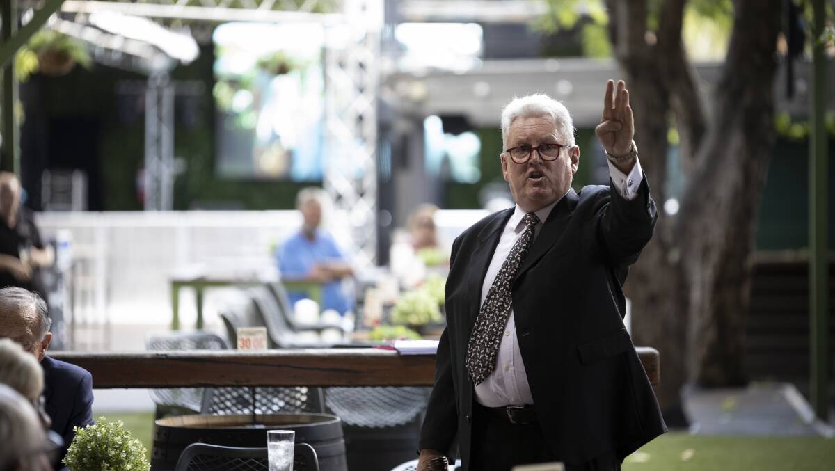 Counting down: Auctioneer Doug May moves to declare the auction over at the New Albury Hotel yesterday afternoon after some rapid-fire bidding. Picture: ASH SMITH