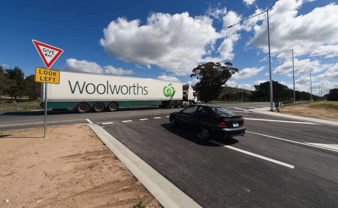 Existing sight: A truck passes through on the Hume Freeway as a motorist waits at the McKoy Street intersection which has been modified and has a reduced speed limit of 80km/h introduced because of safety concerns. Picture: MARK JESSER 