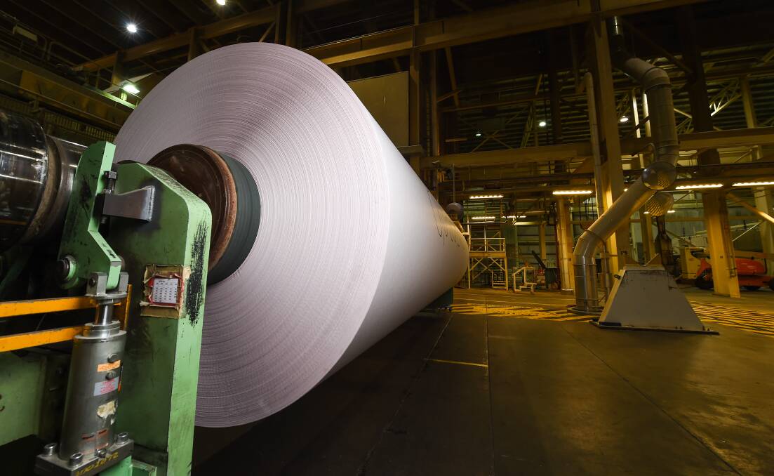 Huge product: The last jumbo reel sits on the paper machine waiting to be transported to along the line to be cut up into smaller sizes to distribute. Laid out it would extend for 53 kilometres. Picture: MARK JESSER 