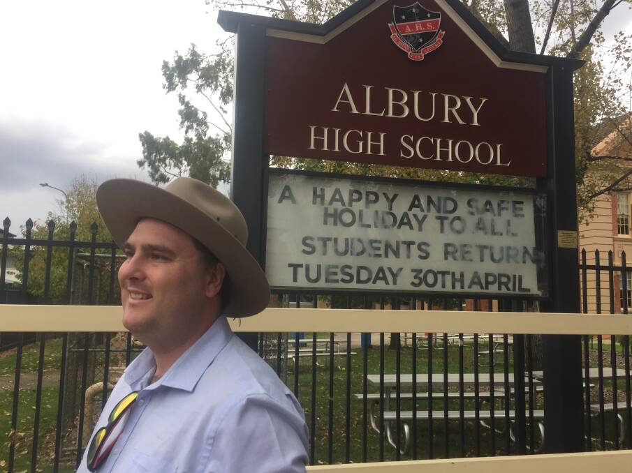 Political class: Labor candidate Kieran Drabsch outside Albury High School on Wednesday morning where he touted funding for public schools. 