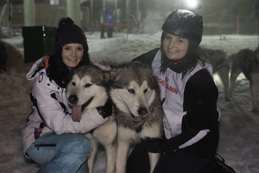 Snow doggies: Euroa competitor Alicia Broad with Goulburn Valley musher E'vette Levett after competing at Falls Creek on Saturday night. Picture: JIRI CECH