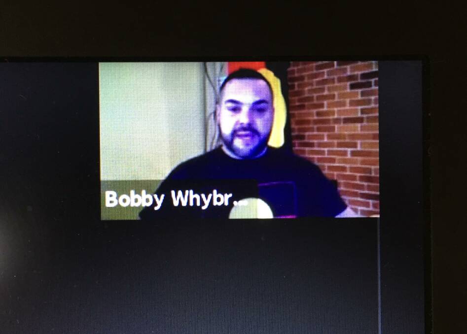 Beamed in: Wiradjuri man Bobby Whybrow addresses the council remotely last night. He said he did not feel comfortable making his presentation in person.
