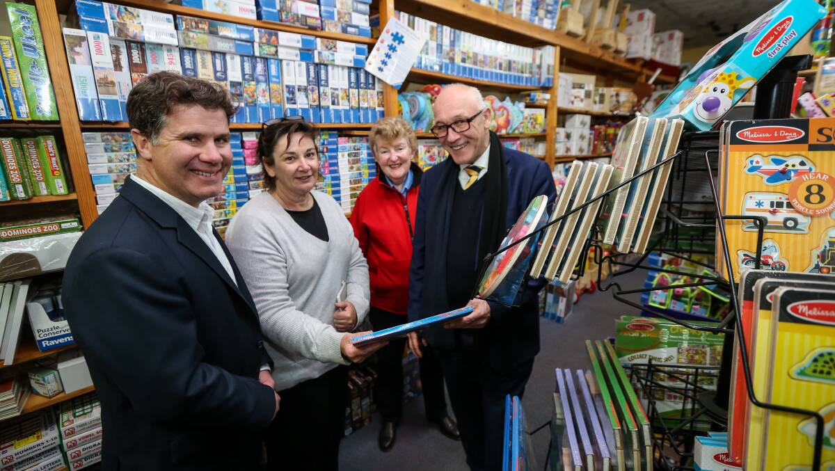 Puzzling: Damien Tudehope (right) with member for Albury Justin Clancy, Who What Why co-owner Heather Jorgensen and Small Business Commissioner Robyn Hobbs at the Dean Street toy shop's jigsaw section. Picture: JAMES WILTSHIRE 