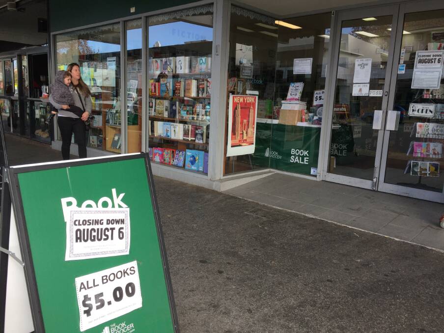 Last days: The writing is on the sandwich board for Albury's Book Grocer outlet. 