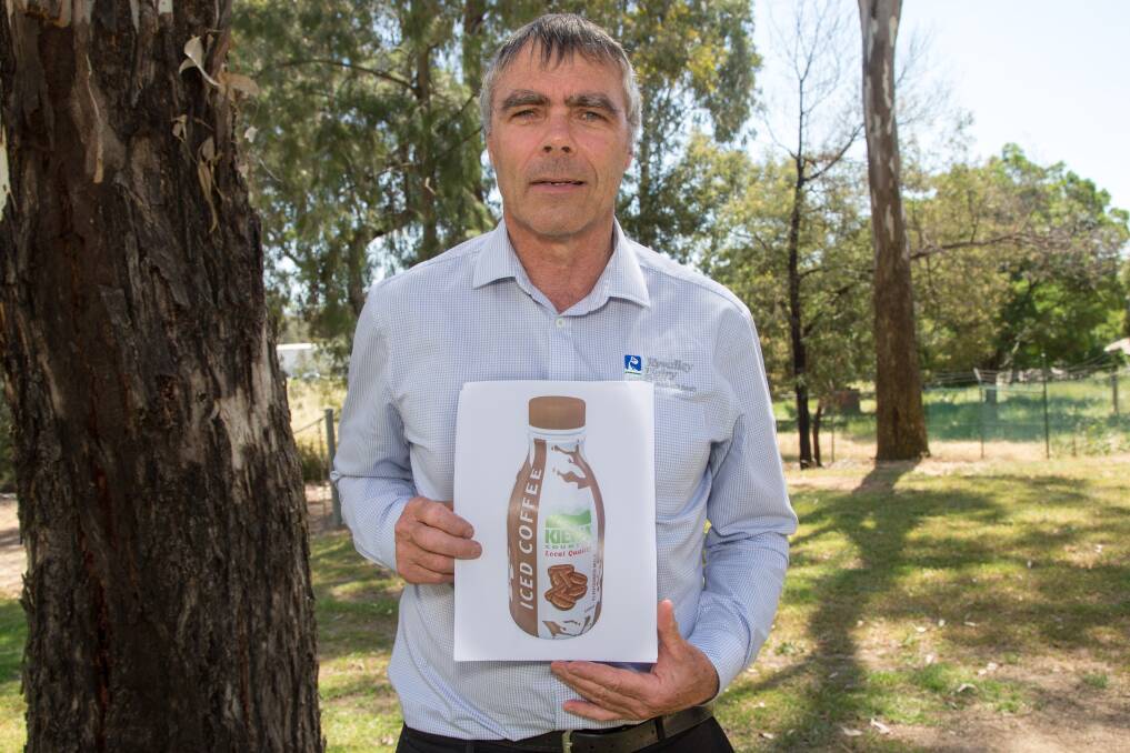 Ready to roll: Kyvalley Dairy Group director Wayne Mulcahy with an image of how the Kiewa Country Iced Coffee will appear when it hits store shelves on Thursday.