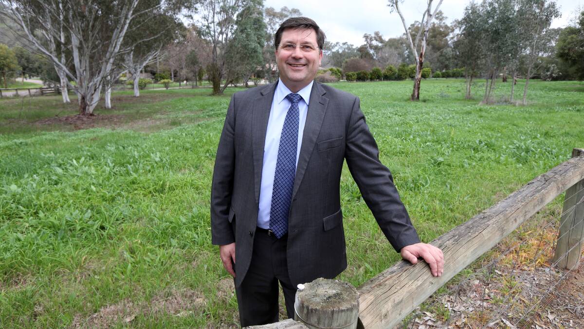 Flashback: Member for Benambra Bill Tilley in 2013 on the site of what is now the west Wodonga ambulance station. He has cited its emergence as a sign of his commitment to improving the city's health services.