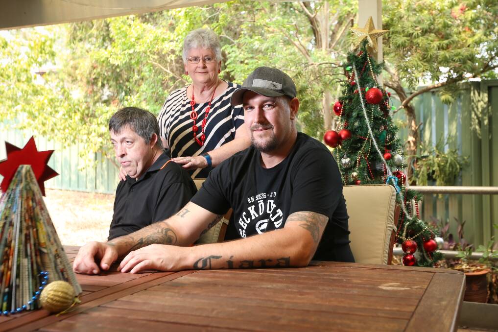 Special bond: West Albury resident David Prentice, who has brain damage, with his mother Denise Prentice and carer Paul McClear who saved his life after a burst varicose vein earlier this month left him comatose. Picture: JAMES WILTSHIRE