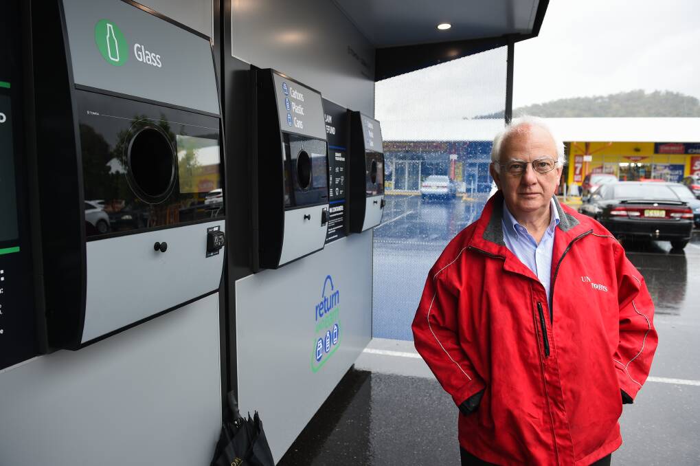 Time to act: Supermarket owner Bob Mathews at the Springdale Heights Return and Earn machine which he is moving to have removed after ongoing concerns.