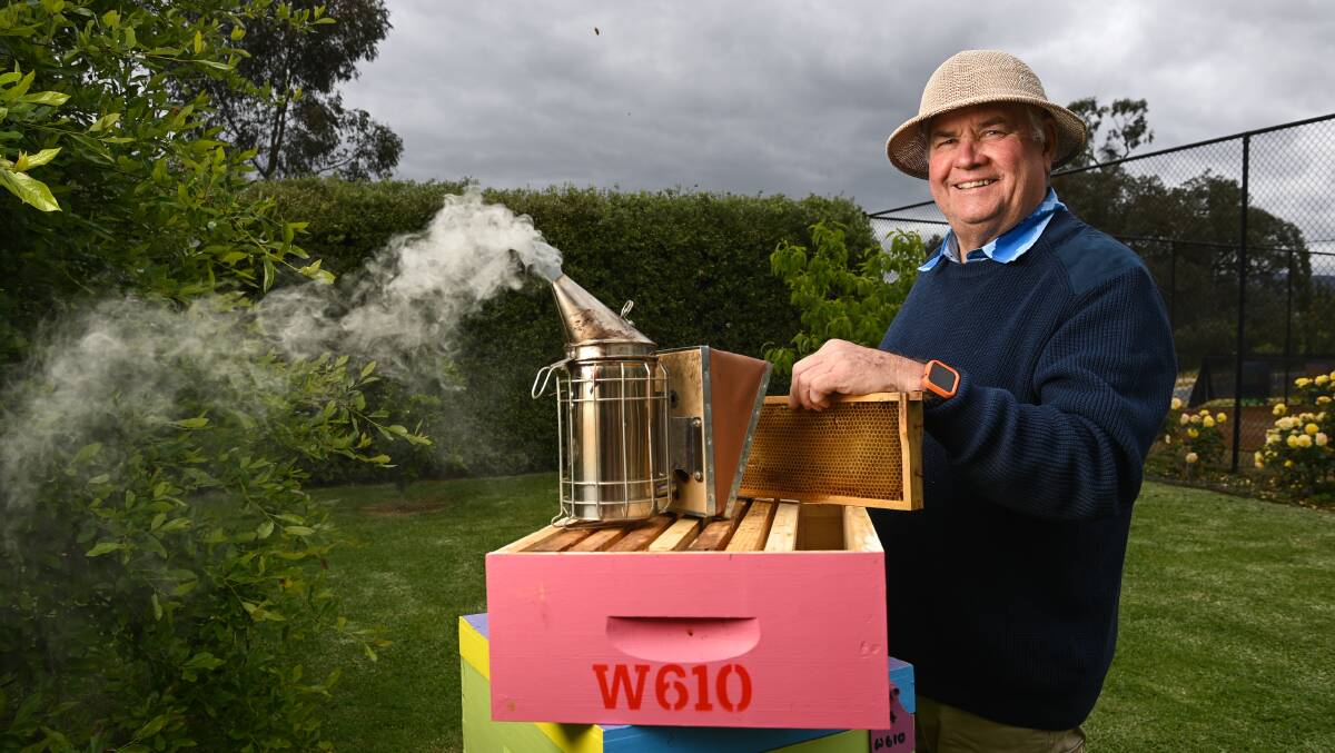 John Watson at home with a smoker and a beehive. Apiary is his biggest passion outside family and he processes honey and makes wax candles. Picture by Mark Jesser
