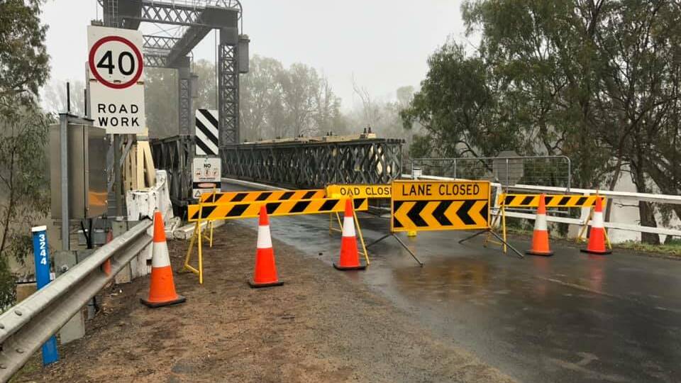 No way through: The sight which greeted motorists at Tooleybuc's Murray River bridge on Wednesday morning following the border crackdown. The closure means many more kilometres will be added to journeys into Victoria.