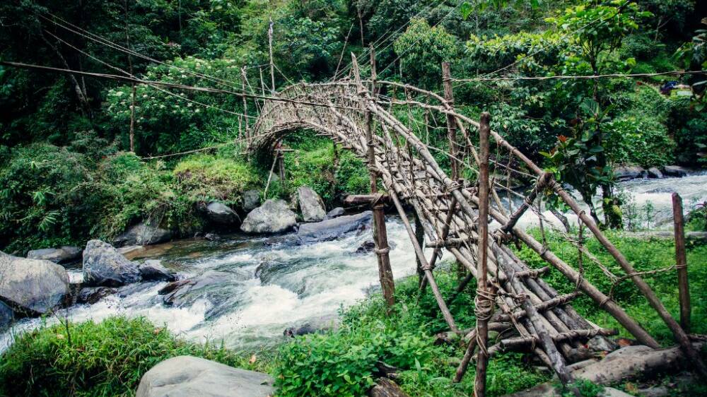 Novel engineering: A wooden bridge along the Kokoda Track. Picture: VISIT PNG
