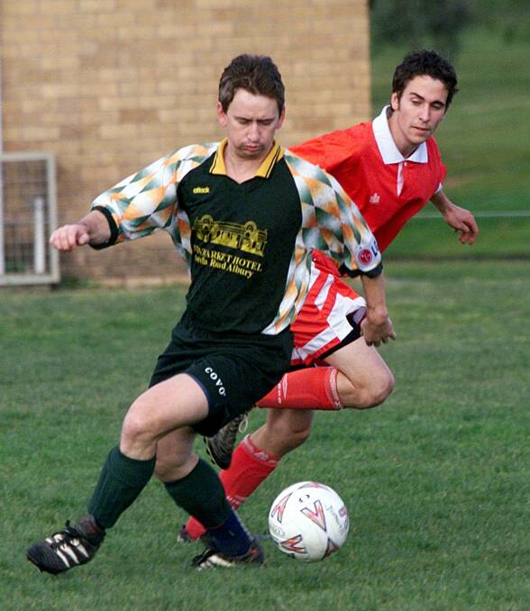 Flashback: Tony Iverson in action for St Patrick's in 2000 against Diamonds player Sam Keating at Melrose Park.