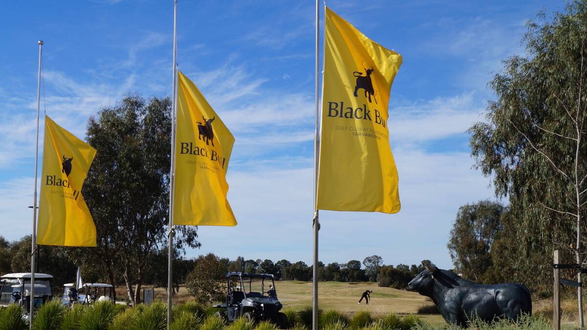 Mark of respect: Flags are lowered to half-mast along the entrance to Yarrawonga's Black Bull course on Wednesday.