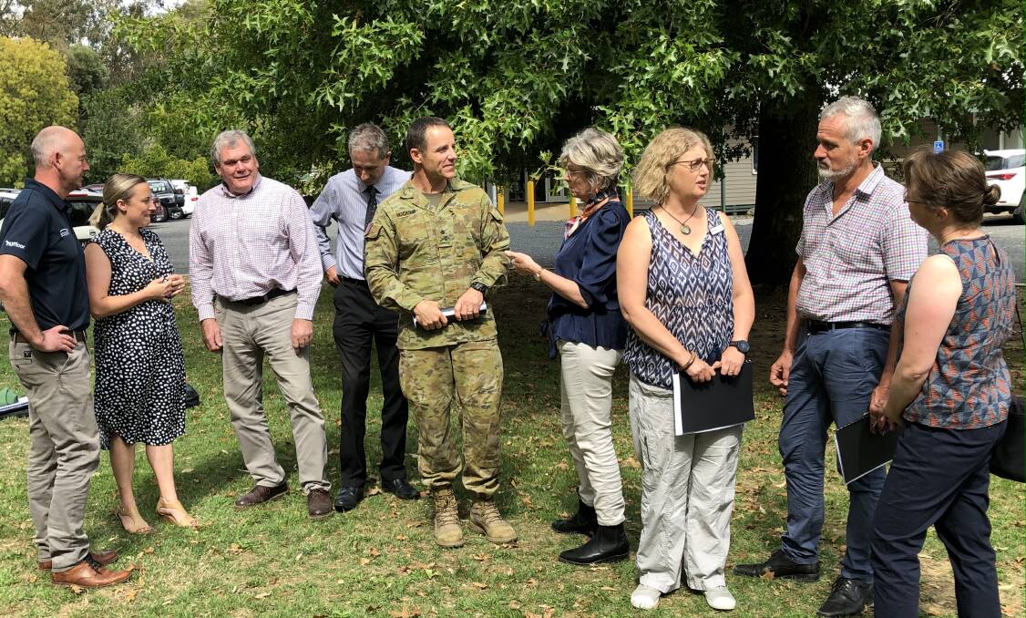 In the planning: Member for Indi Helen Haines speaks with National Bushfire Recovery Agency deputy co-ordinator Major General Andrew Hocking in March while timber industry figures surround them. HVP chief operating officer Rob Hescock is second from the right.
