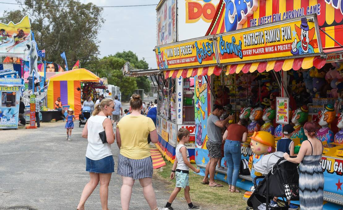 Roll up or roll over: Uncertainty surrounds whether the Albury Show will be held this year given the COVID situation and if patrons, like these in 2019, will be able to return to try their luck on the clowns.