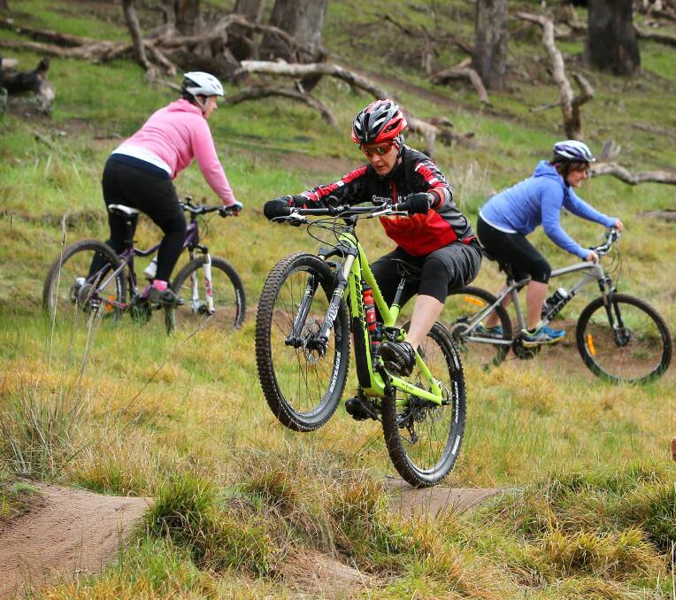 On track: Mountain bikers ride one of the tracks at the Hunchback Hill park which have drawn criticism.