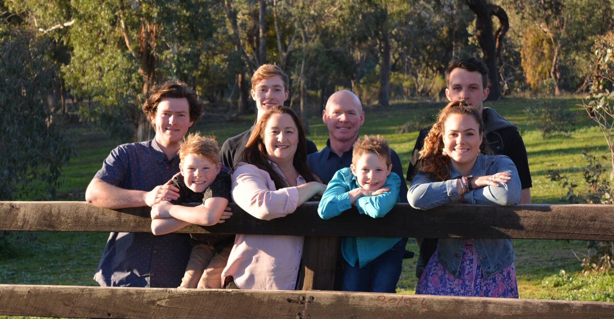 In the red corner: Labor candidate for Euroa Fionna Deppeler-Morton with partner Drew Morton and their children (from left) Max, 19, Cody, 9, Charlie, 18, Nate,6, and Nicole, 22, and her boyfriend Jack at their horse farm outside Broadford.