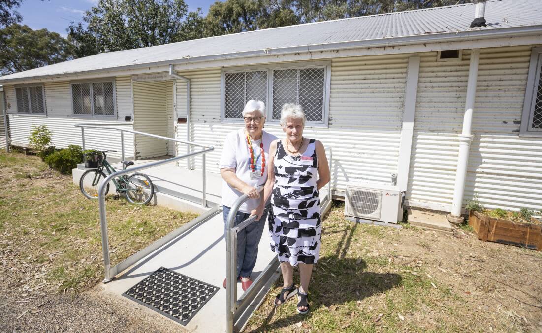 Fresh repository: Wodonga Historical Society leaders Marie Elliot and Julie Star in front of the building at Block 19 at Bonegilla which now houses artefacts. Picture: ASH SMITH