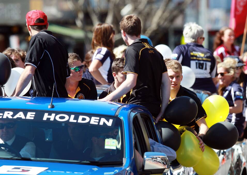 Central role: McRae Motors Holdens are used in a grand final parade for the Ovens and Murray Football and Netball League.