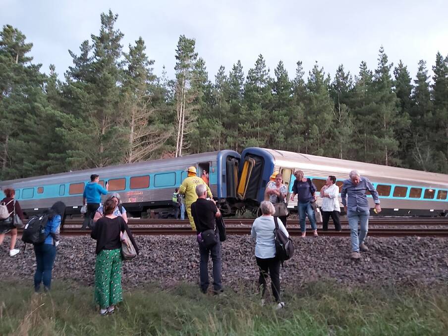 Awful: Passengers flee the derailed train at Wallan. Picture: SCOTT RICKARD