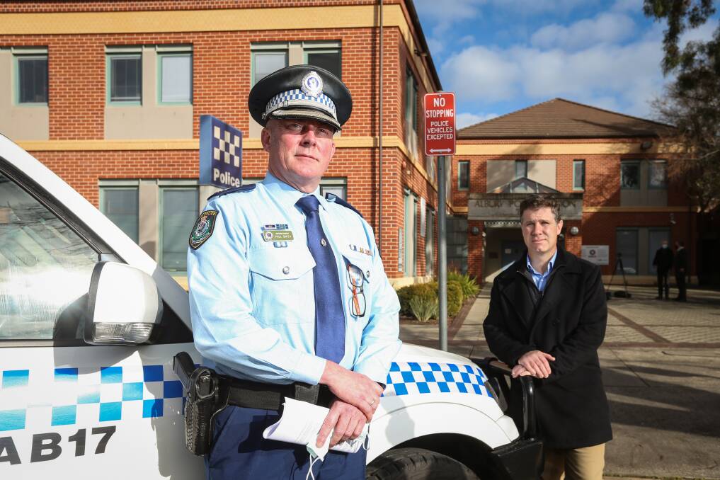 Cracking down: Murray River police region chief Superintendent Paul Smith and member for Albury Justin Clancy outside the Albury police station. The police chief says roving patrols are netting rogue Sydneysiders. Picture: JAMES WILTSHIRE