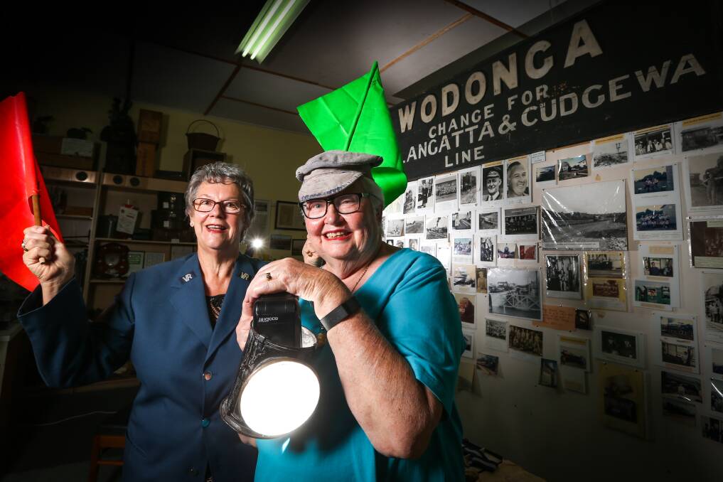 Flying the flag: Uta Wiltshire and Marie Elliot at the historical society's South Street shopfront with railway heritage items in its collection which would form part of a museum archive.