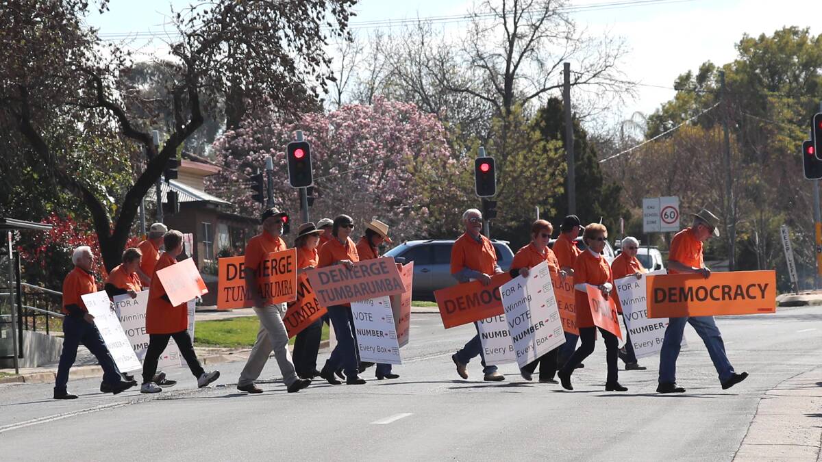 On the move: Tumbarumba residents opposed to their town's council merger during a protest in Wagga which coincided with the recent by-election for the Riverina city's NSW seat. Picture: DAILY ADVERTISER