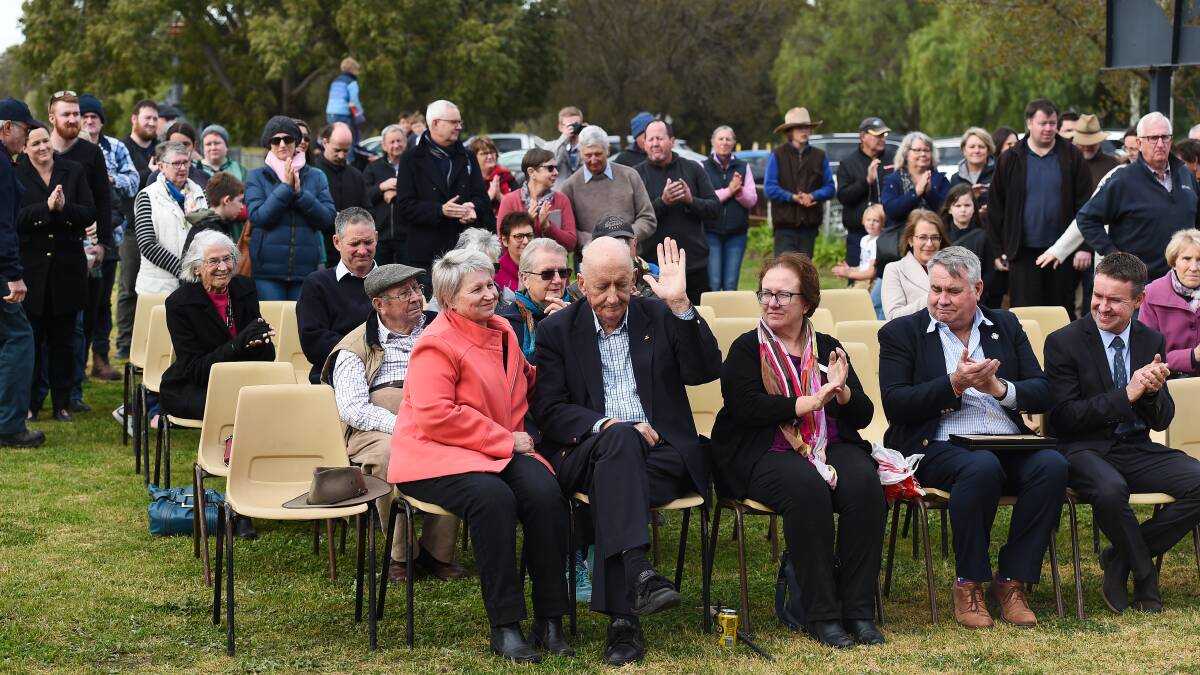 Thank you: Mr Fischer, sitting alongside his wife Judy Brewer, acknowledges the applause at Boree Creek last month when a park was named in his honour. To his left are Albury Wodonga cancer centre board members Anne-Marie Humphries and John Watson and Federation Council chief executive Adrian Butler.