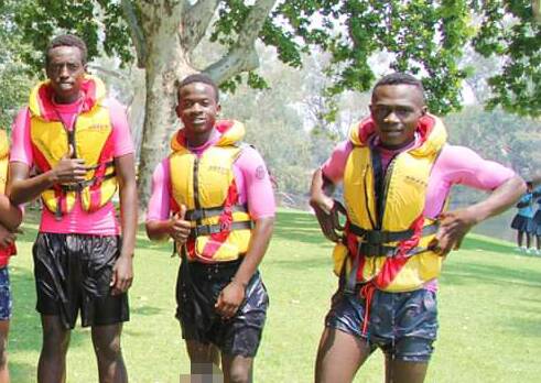 Lesson session: Jules Lunanga (right) with his friends Mutabazi Jeanpaul and Moise Nsabimana at a swimming lesson on the Murray River last year.