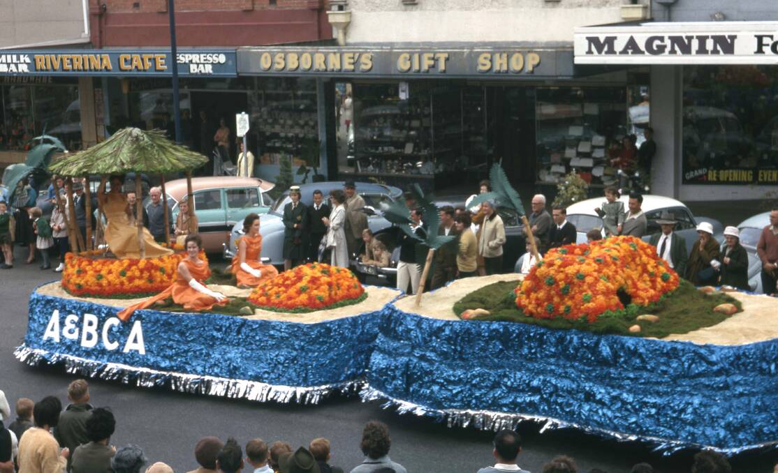 The way we were: Scores watch on as a float passes along Dean Street during an edition of the Albury Floral Festival.
