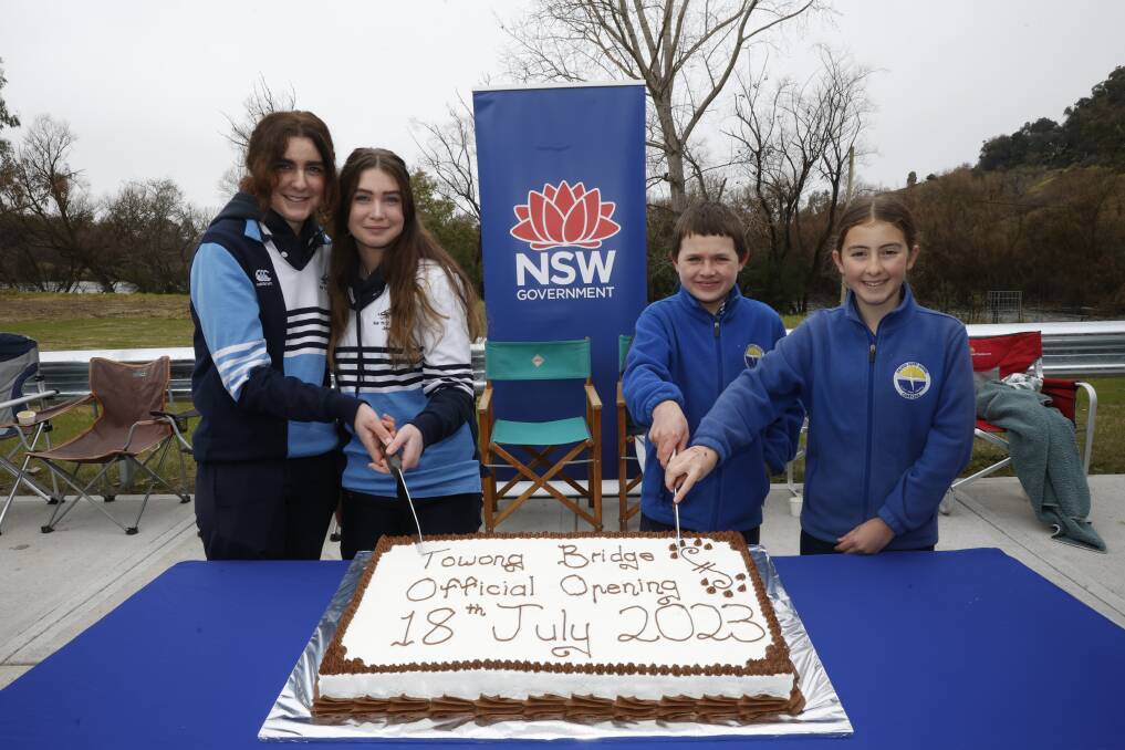 Corryong College year 11 students Ruby Scammell and Jasmine Cane joined Sacred Heart Catholic School year 6 pupils Declan Faithfull and Amy Costello in cutting the official combined carrot and chocolate cake made by the Upper Murray Community Bakery. Picture by The Corryong Courier 