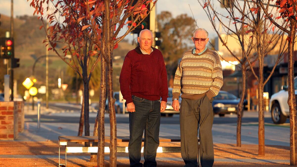 Welcome news: Jack Hore's sons Ross and Colin, pictured in May 2015, with the former Jack Hore Place, now Elgin Boulevard, behind them. 