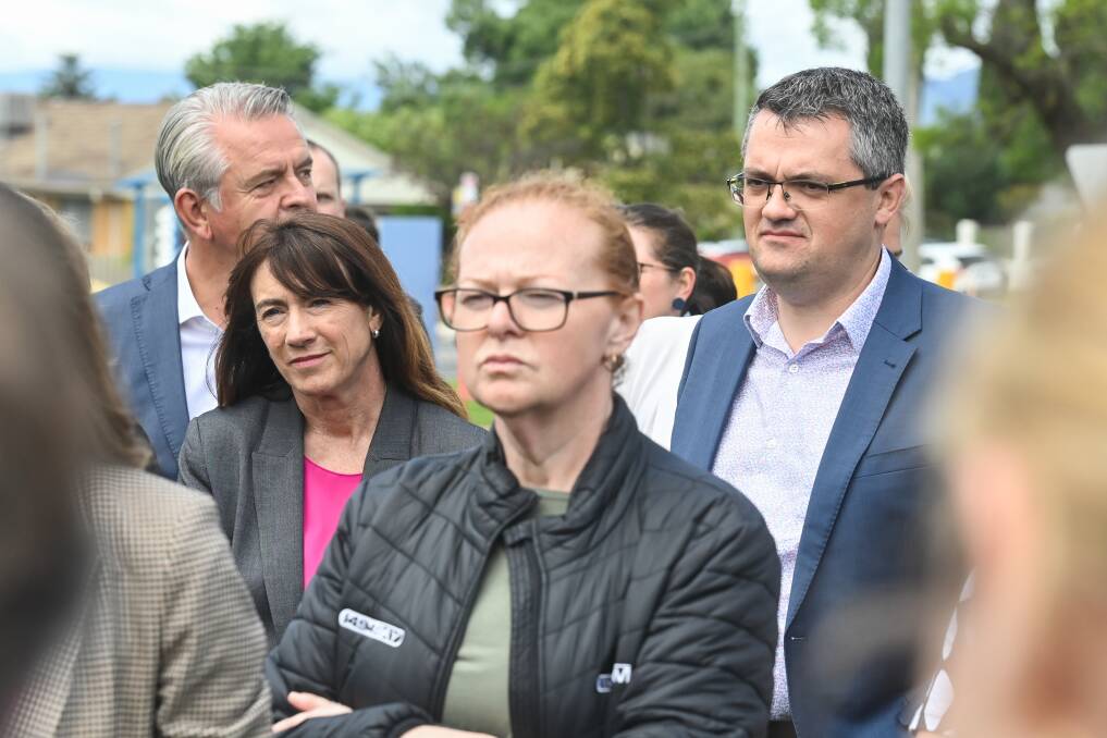 Kev Poulton (right) at the announcement of a hospital upgrade for Albury in October. He has now set down a challenge for Albury mayor Kylie King (second from left) and her council to join Wodonga in advocating for a single-site greenfields hospital.