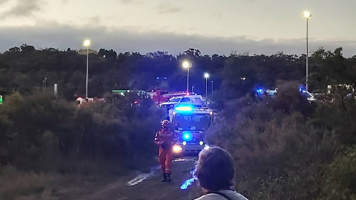 Emergency set-up: Lights of first aid vehicles are clear near the scene of the derailment. A makeshift triage centre was set-up at a BP service station on the nearby Hume Freeway. Picture: SCOTT RICKARD