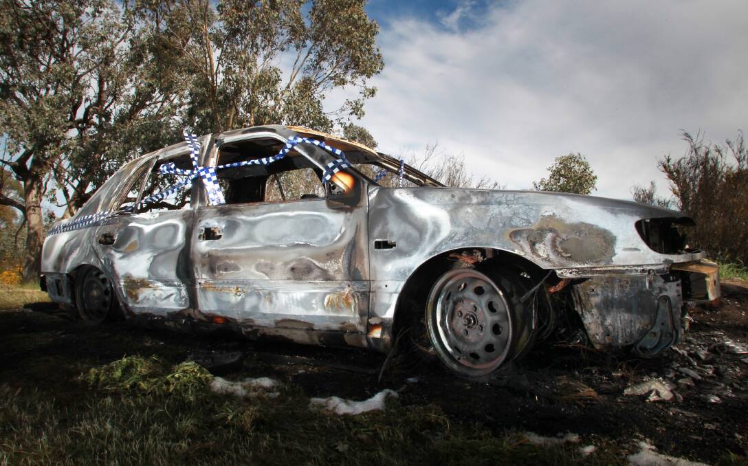 Sign of trouble: A burnt out car dumped at the Eastern Hill lookout. Security cameras are among measures proposed to address troubling behaviour in the area.
