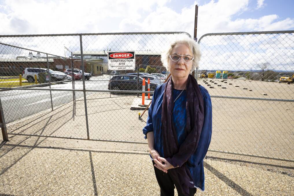 Work set to start: Susan Medlin in front of the car park which will be shut and blocks that will support huts for tradies during the project. Picture: ASH SMITH