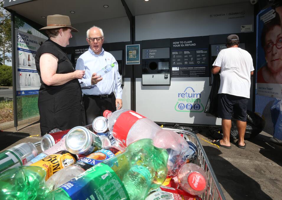 Fed up: Small Business Commissioner Robyn Hobbs with supermarket owner Bob Mathews at the can and bottle machine outside his store. He said police were called there last week after arguments over trolleys. Picture: KYLIE ESLER