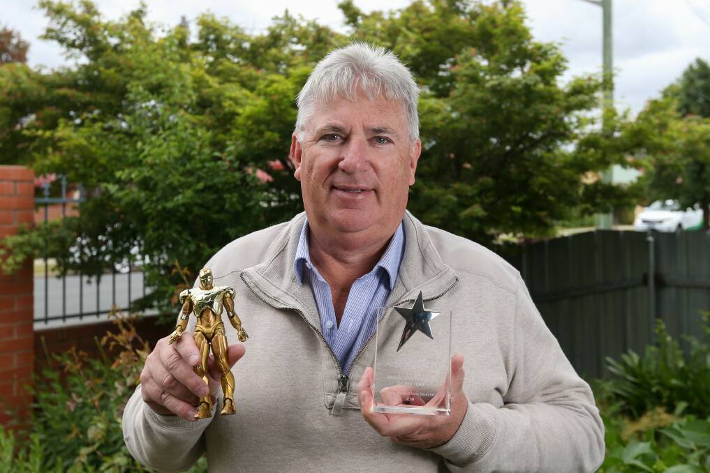 Symbols of success: Phil Badura with the keepsakes he received for winning awards within his business coaching company. Picture: TARA TREWHELLA