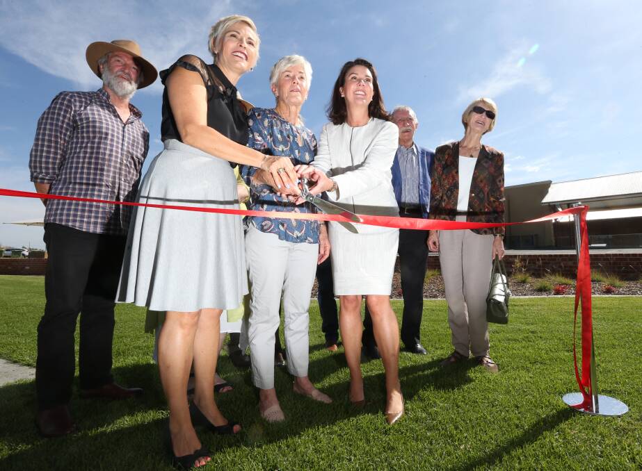 Opened: Mayor Anna Speedie, Robert Richardson's grand-daughter Susan Cooper and Senator Jane Hume snip a ribbon to officially open Richardson Park as other descendants look on. Picture: KYLIE ESLER