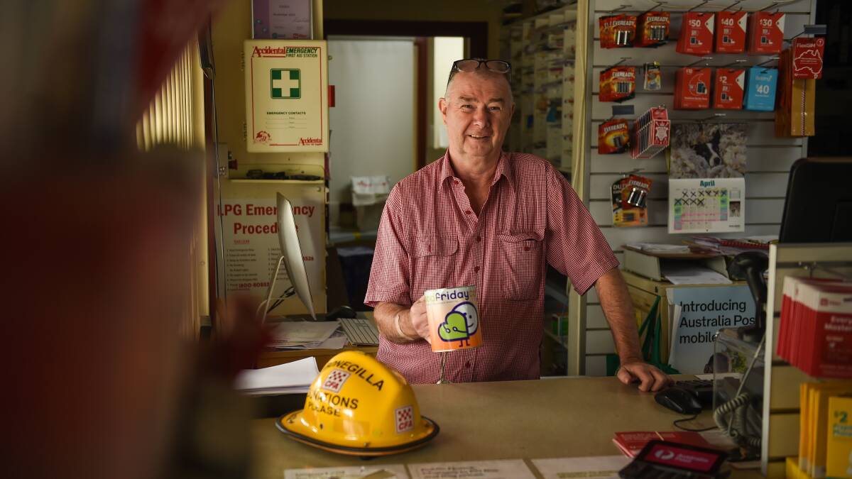 Phil Singleton at the Kangaroo General Store at Bonegilla has been collecting donations for the Good Friday Appeal since 1990.