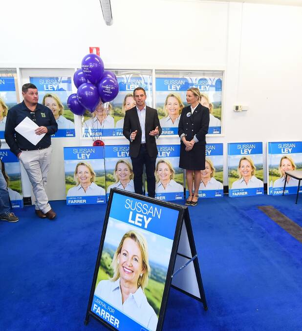 Funding promise: Liberal candidate Steve Martin announces a cash commitment for Boys in the Bush while flanked by one of the program's founders Adam DeMamiel and member for Farrer Sussan Ley. Picture: MARK JESSER 