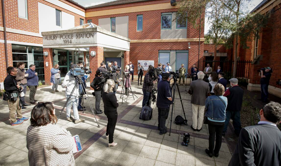 Spot the Premier: Gladys Berejiklian faces the media outside Albury police station yesterday. Picture: JAMES WILTSHIRE