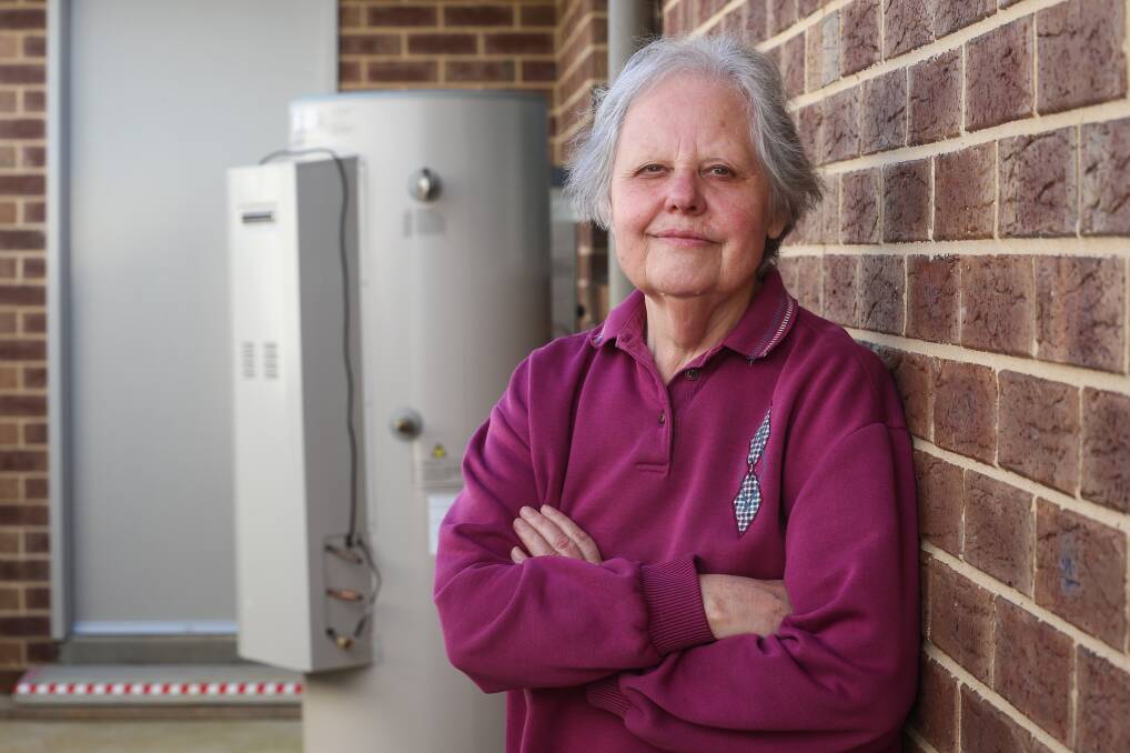Boiling point: Joan Bramley with her Dux hot water unit which she had disconnected and replaced after it failed. Picture: JAMES WILTSHIRE